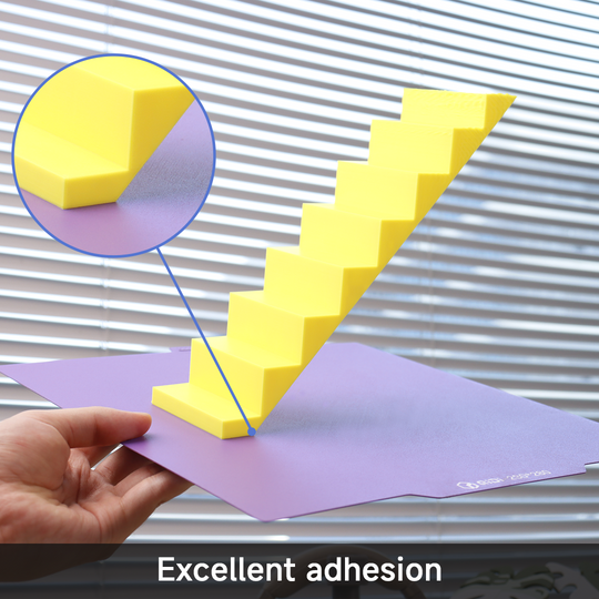 QIDI Cool Plate Pro demonstrating excellent adhesion with a yellow staircase print on a purple build plate.